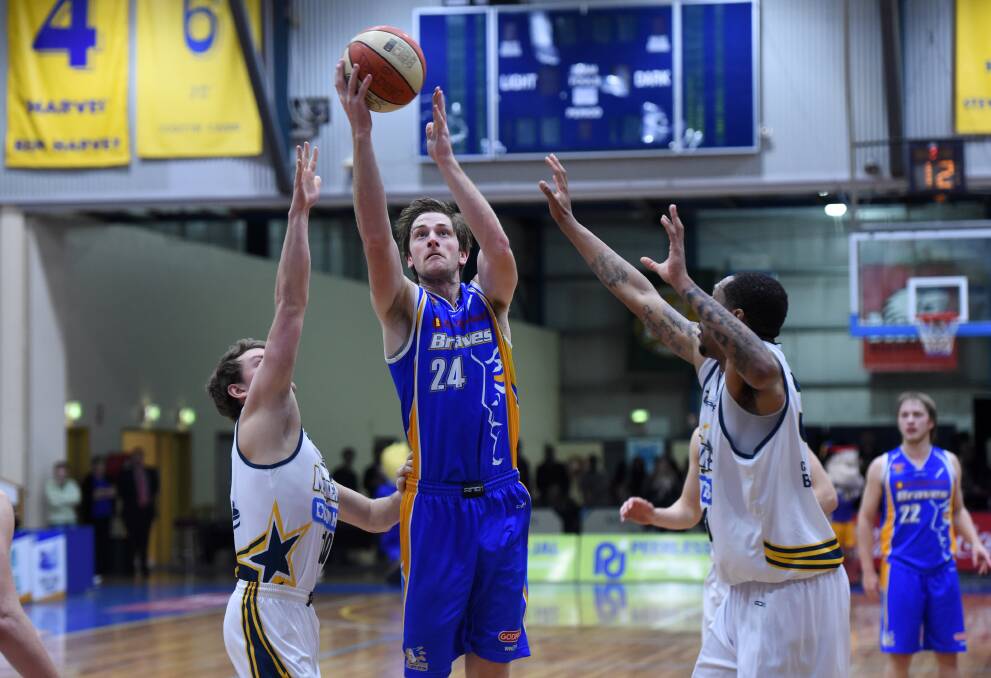 MILESTONE MAN: Bendigo Braves co-captain Chris Hogan in action against the Ballarat Miners in the South East Australia Basketball League competition. Picture: JODIE WIEGARD