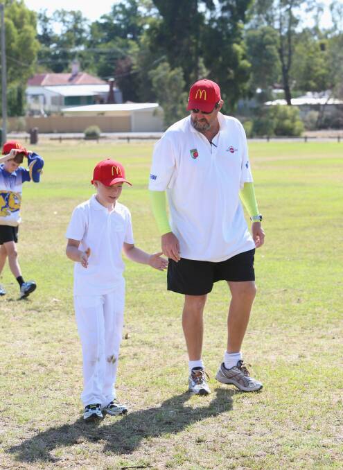 McDonald's Summer Cricket Camp at Ewing Park Bendigo.
Spin bowler Harley Lamers gets a pointers from Terry Alderman.
Picture: PETER WEAVING