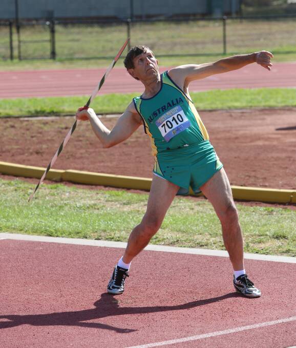AIM: Andrew Fraser tries his best at the javelin. Picture: PETER WEAVING