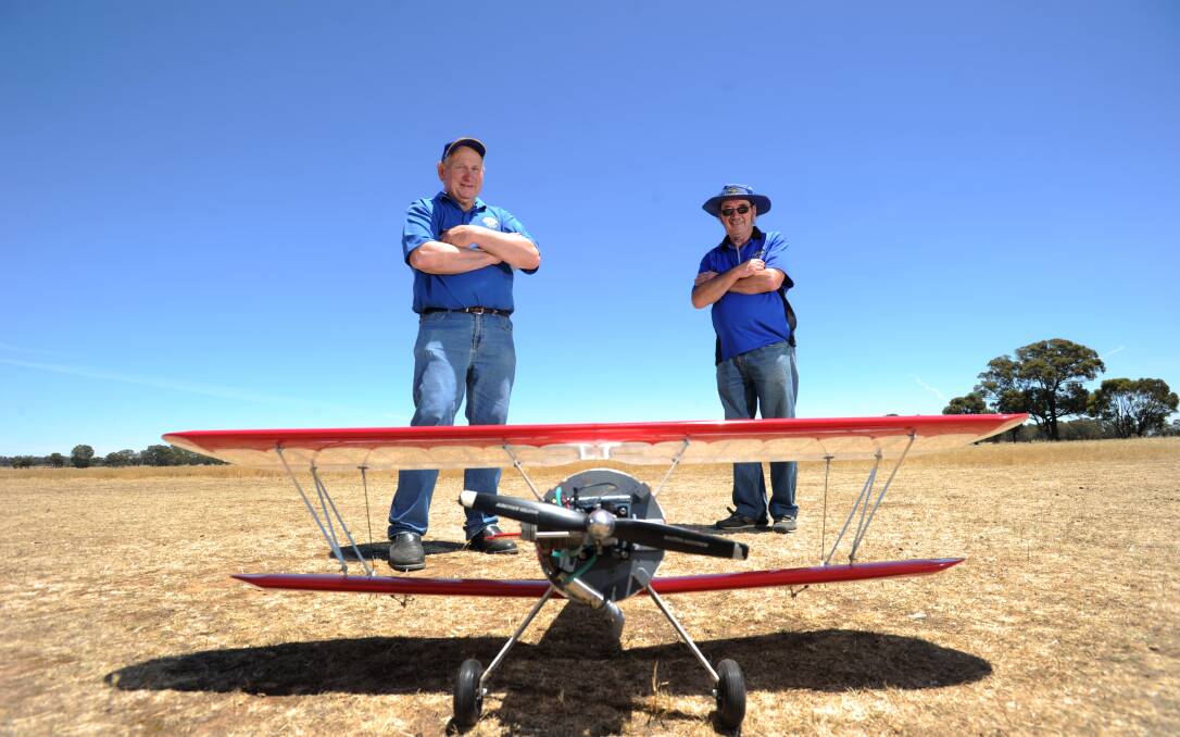 CELEBRATE: Les Davis and Alan Uren from the Bendigo Radio Controlled Aircraft Club. Picture: JODIE DONNELLAN