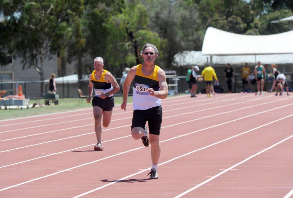 SPRINT: Greg Champion competes in the 100m dash. Picture: JODIE DONNELLAN