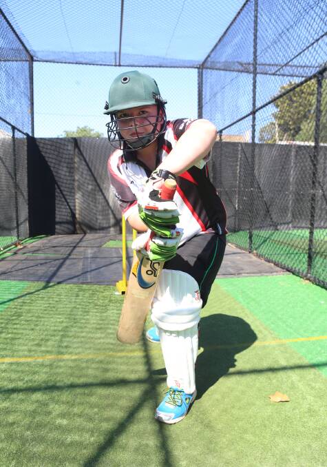POWER: Adam Button practices his batting in the Ewing Park nets.