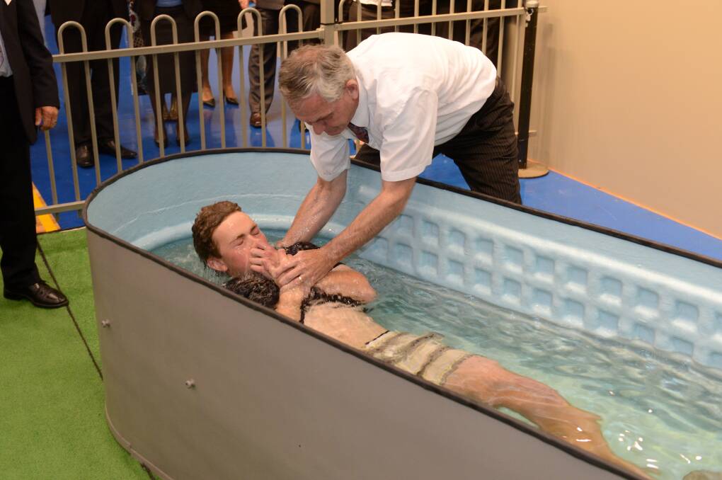 Liam Aucutt from Bendigo is baptised by Steve Marshall at the District Convention of Jehovah's Witnesses. Picture: JIM ALDERSEY