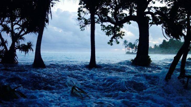 The Marshall Islands hit by king tides. It is one of the South Pacific nations researchers say are facing unaffordable costs to protect their coastal buildings. Photo: Benedict D. Yamamura