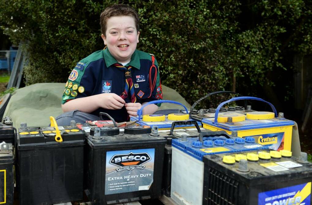 Scout Corey Loader, 14, is selling used car batteries to raise money for his carer to attend the Australian Jamboree next year. Picture: Kate Healy