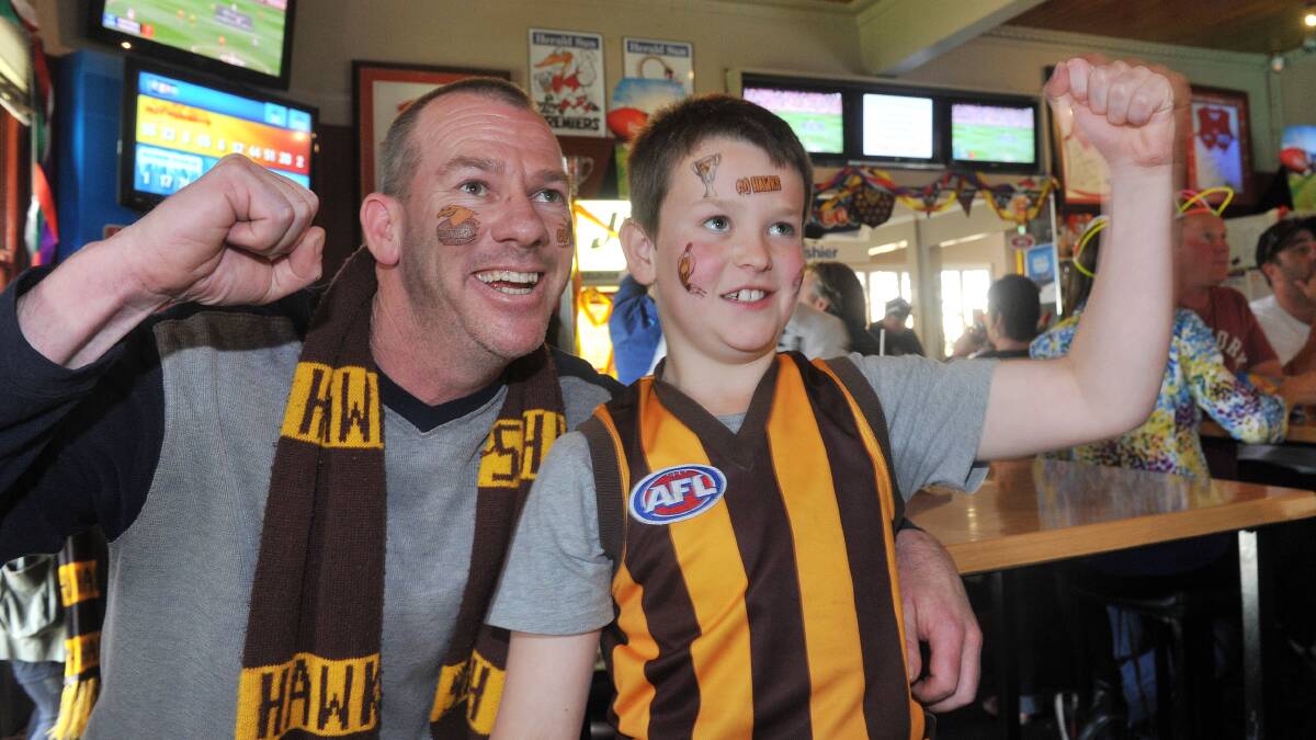 Hawthorn supporters Duane and Jackson Dole at the Hibernian Hotel, Golden Square. Picture: JULIE HOUGH