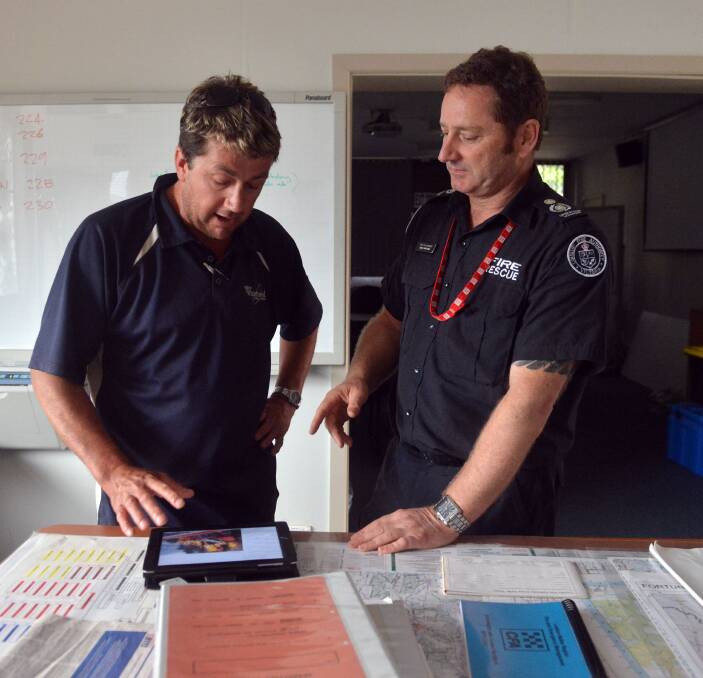 Newstead Brigade Deputy Group Officer Brett Stutchbree and CFA Operations Officer Craig Brittain debriefing in the Ops Centre. Picture: Brendan McCarthy