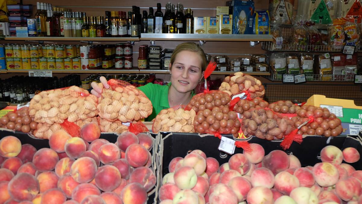 Sophie Tulloch looks over the mounds of local produce at Castlemaine Fresh. 
