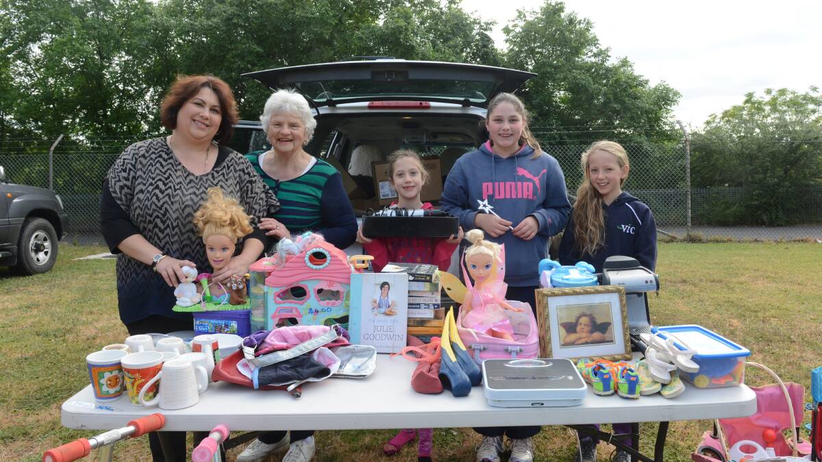 Rachael Lyne, Jan Spencely, Sophie and Grace Lyne with Harliai Curthoys-Davies at the Bendigo Hawks garage sale on the Garage Sale Trail. Picture: JIM ALDERSEY