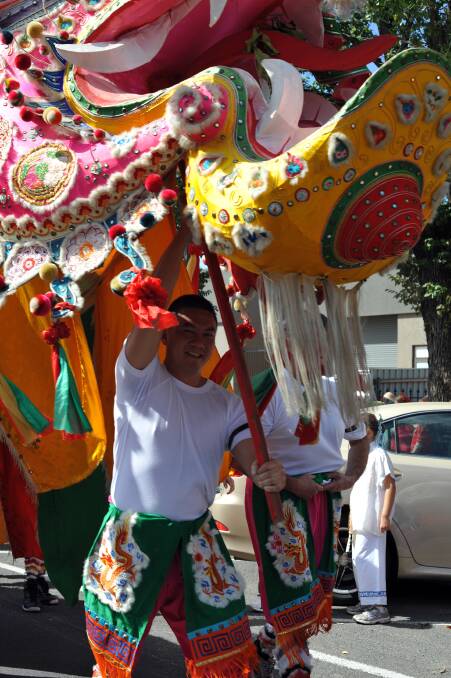 Richard Louey carries Sun Loong during the 2010 Bendigo Easter Parade. Picture: CONTRIBUTED