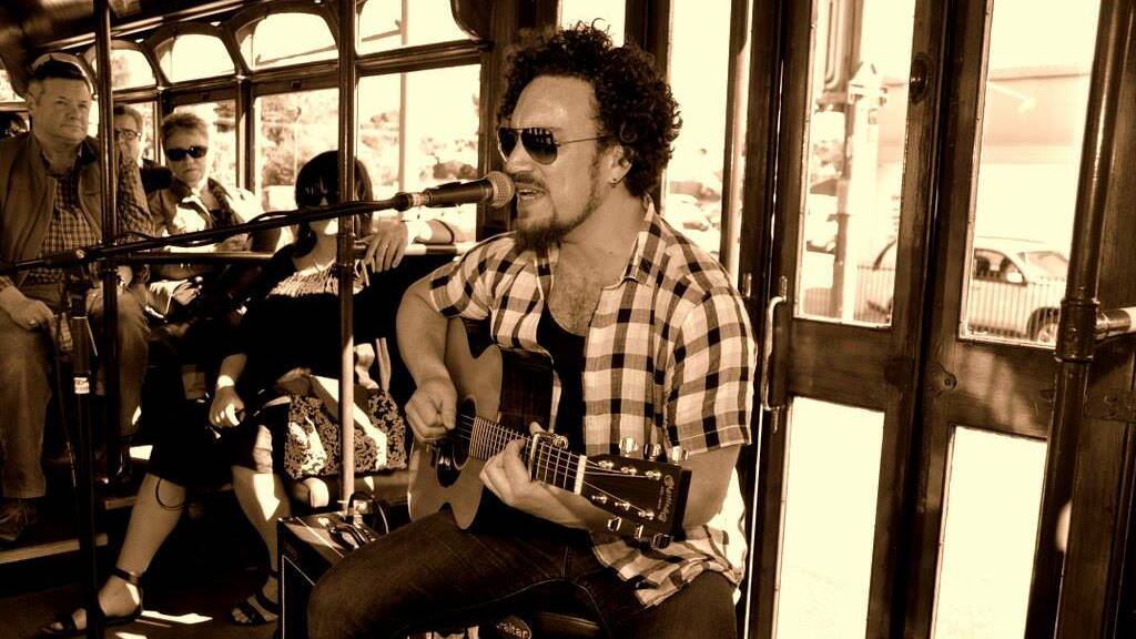 SINGING: Josh Owen performing on the Blues Tram. 
Picture: COURTESY JIM MARSHALL