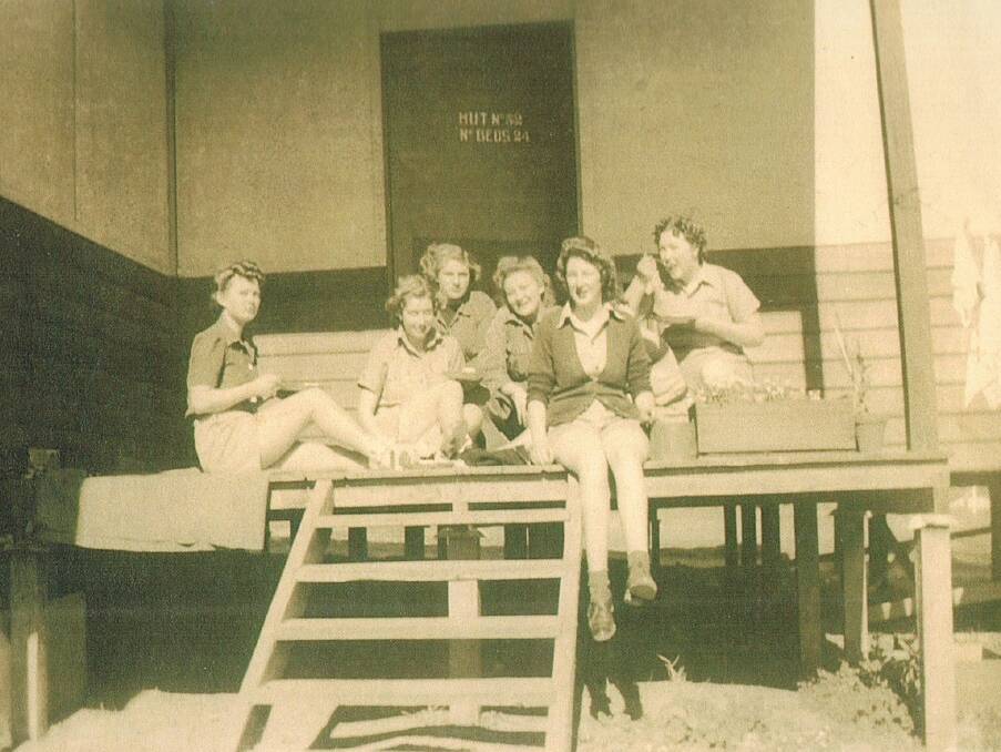 MEMORIES: Lin MacDonald (with her legs hanging off the deck) and her night shift crew enjoying some tinned fruit. Picture: CONTRIBUTED