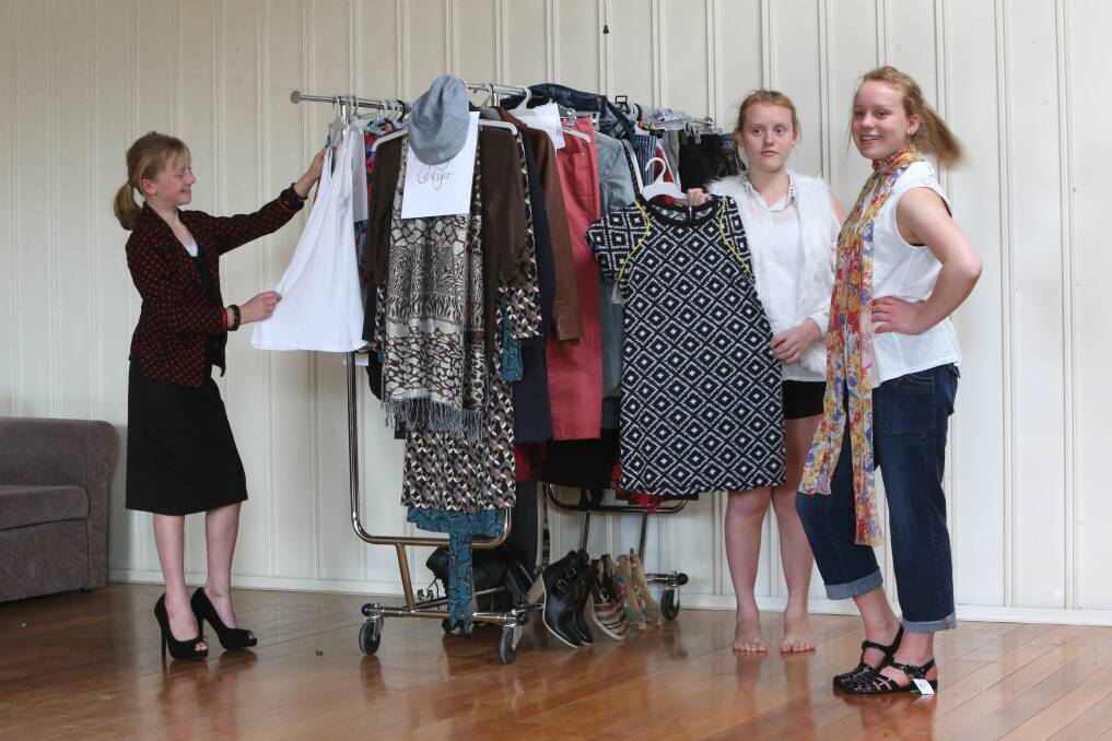 Esther, Miriam and Becky check out the fashion ahead of the parade. Picture: PETER WEAVING