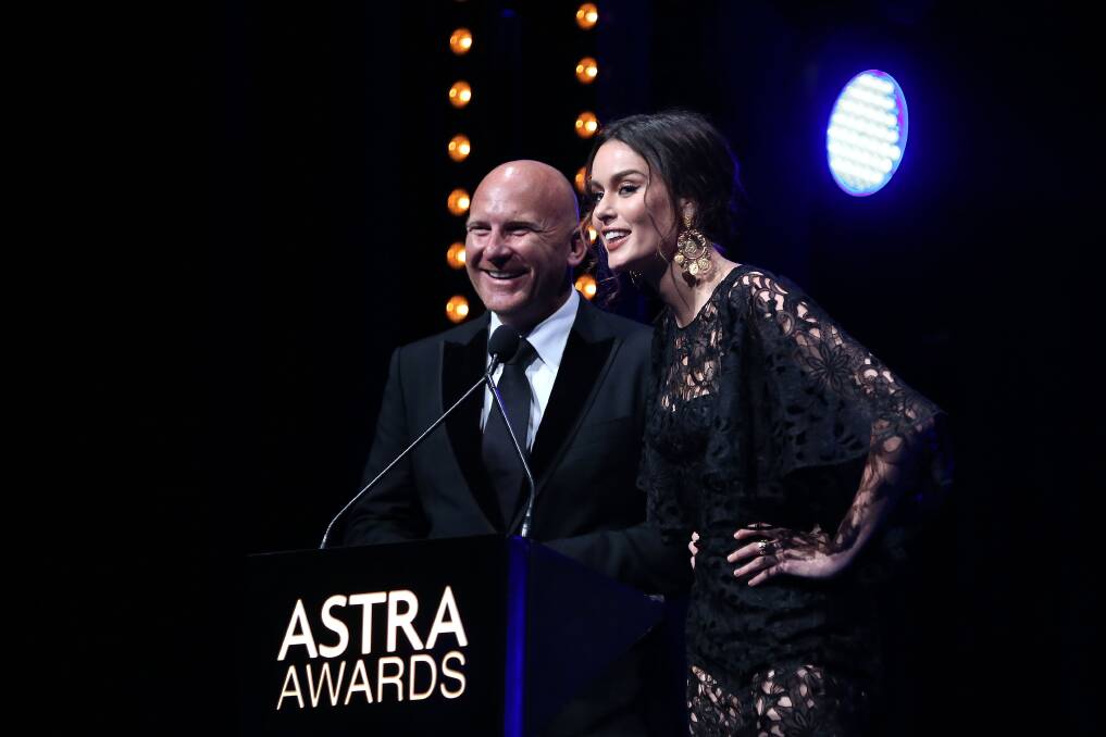 STARS: Matt Moran and Nicole Trunfio present an award during the ASTRA Awards at Carriageworks in Sydney. Picture: GETTY IMAGES