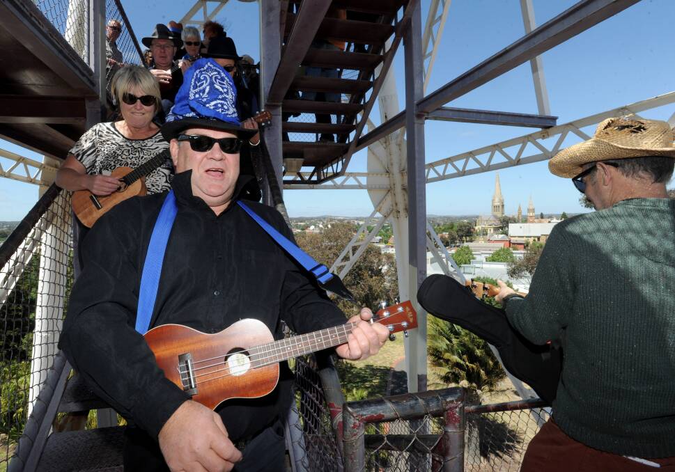 World record of ukulele players at the top of the poppet head to launch the Bendigo Blues and Roots Music Festival. 
Picture: JODIE DONNELLAN
