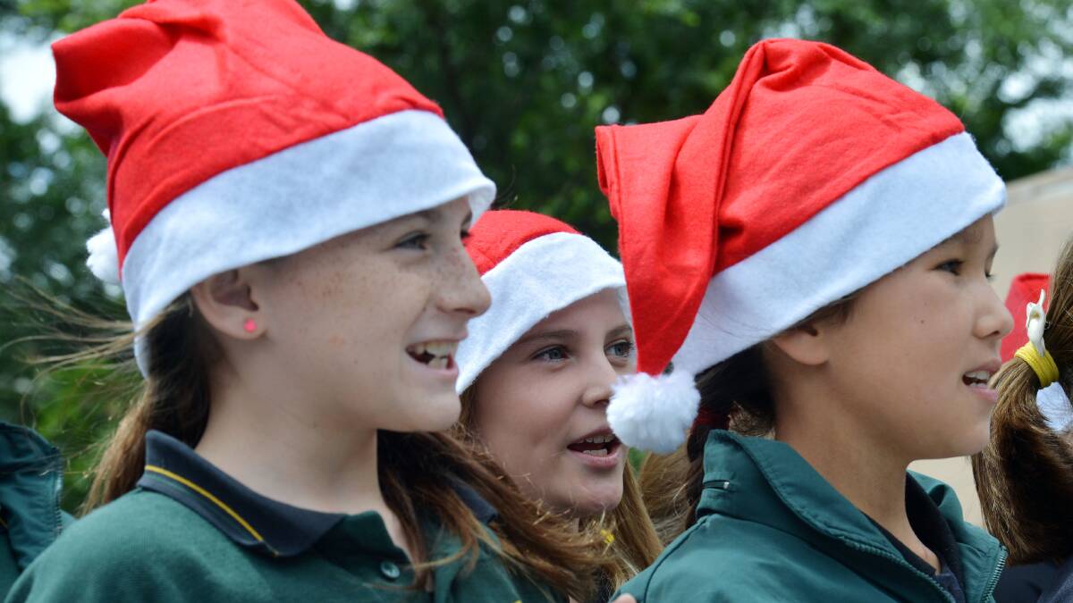 FUN: Primary school students sing Christmas carols in the Mall. 