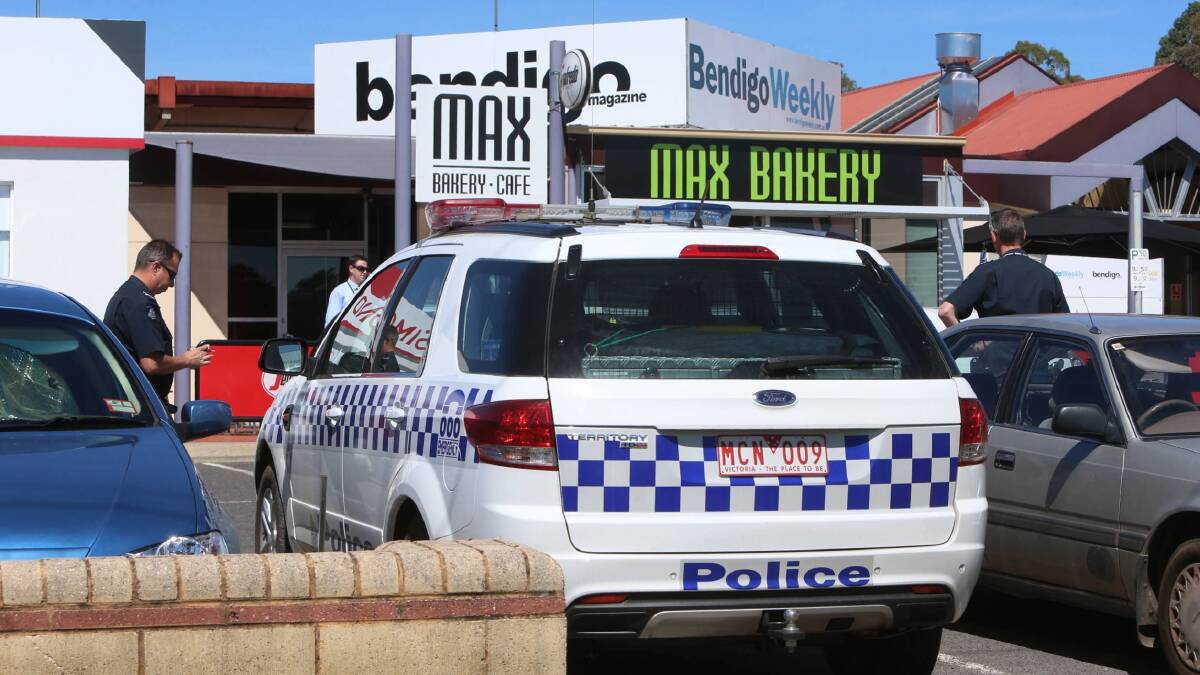 HOLD UP: Police arrest a male after an armed robbery at Max Bakery this morning. Picture: PETER WEAVING