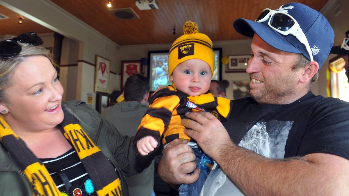 Hawthorn supporters Candice, Murphy and Jason Wallace at the Hibernian Hotel, Golden Square.Picture: JULIE HOUGH
