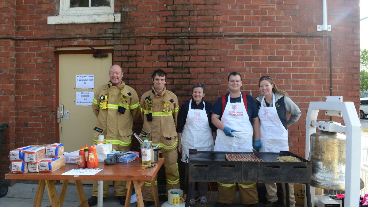 Brigade fire fighters Paul Bellinger, Jason Pearce, Mel Davis, Shane Clinch and Amy Chandler at the Golden Square CFA's garage sale on the Garage Sale Trail. Picture: JIM ALDERSEY