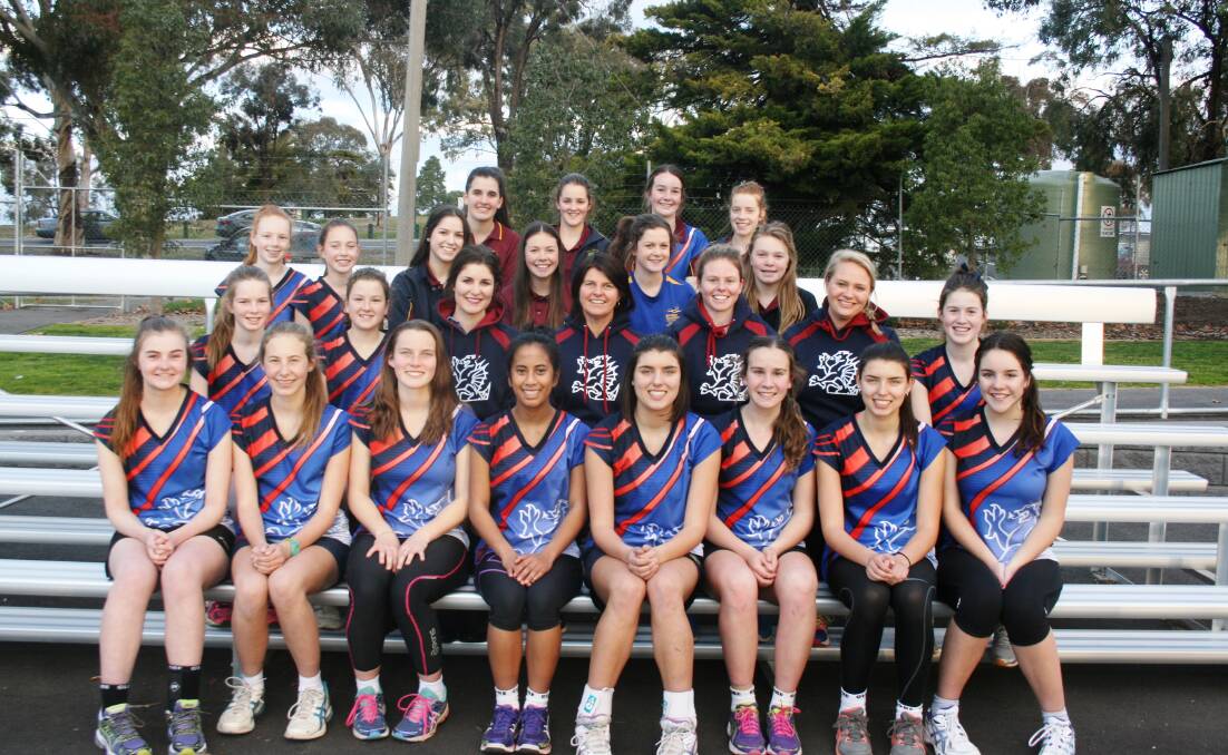 Carol Cathcart, middle, with some of Sandhurst's netball squad. Picture: Supplied.