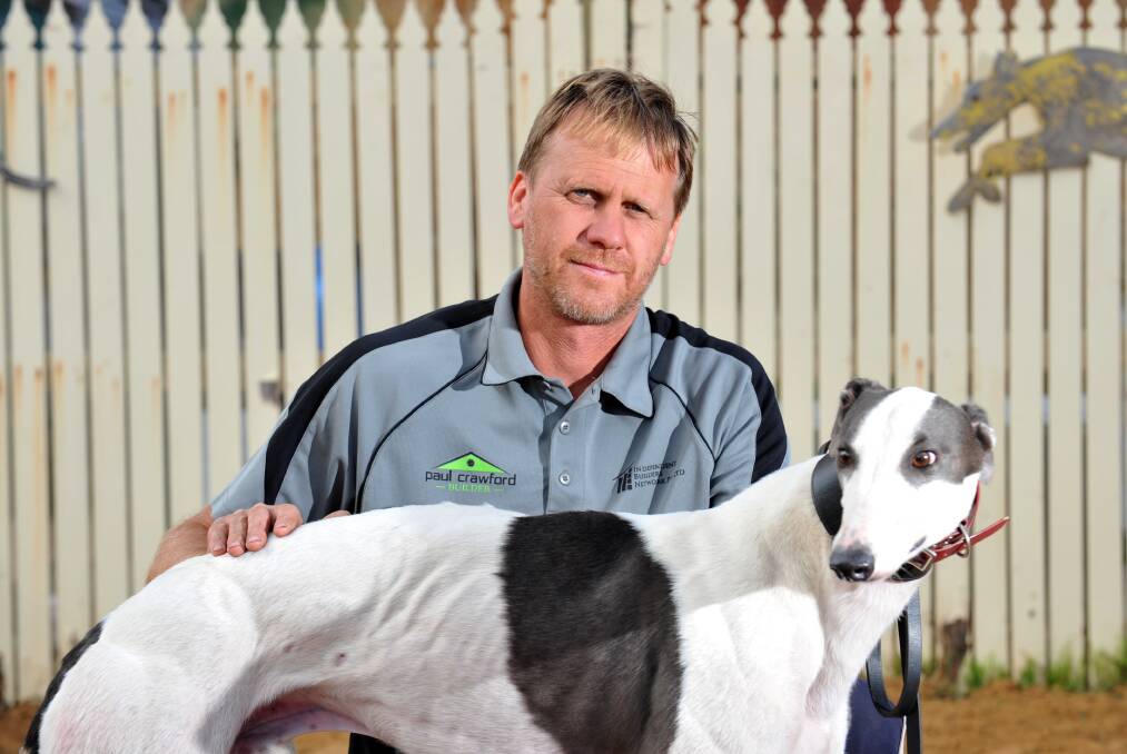 HIGH HOPES: Bendigo greyhound trainer Scott McKenzie with Matt's Entity. Picture: JODIE DONNELLAN