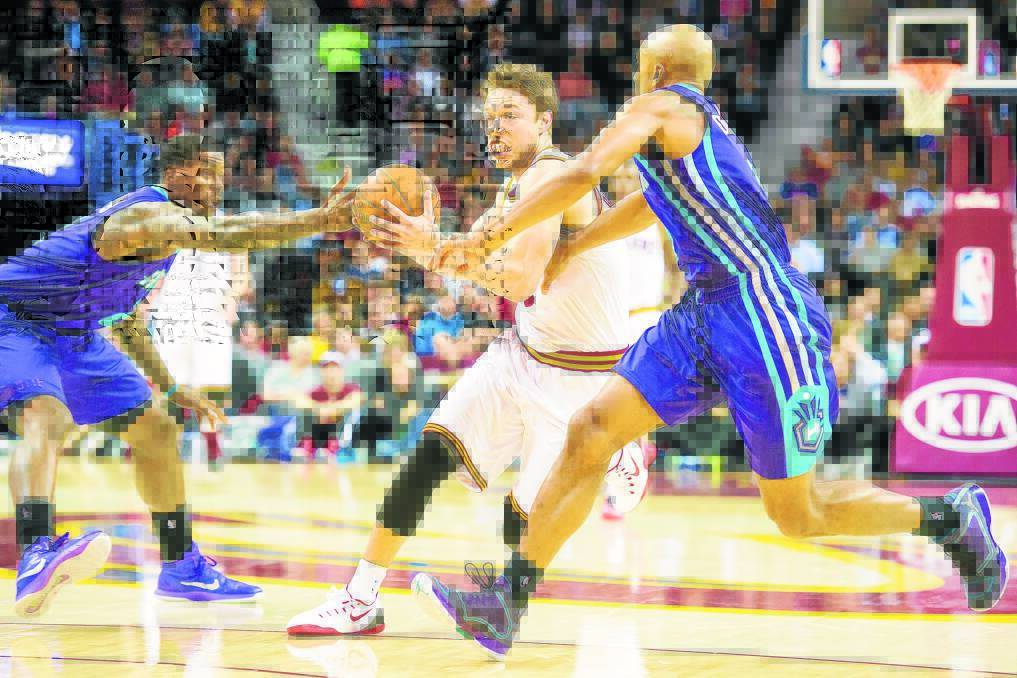 BACK IN ACTION: Matthew Dellavedova takes on the Charlotte Hornets' defence. Picture: GETTY IMAGES
