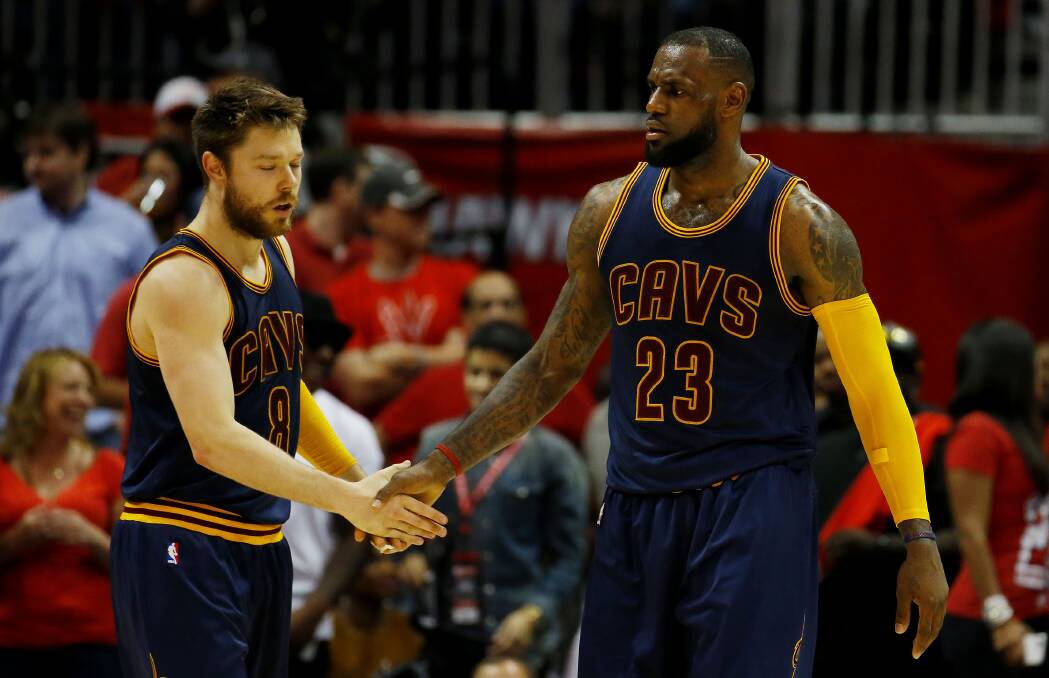 HIGH FIVE: Matthew Dellavedova with Cleveland Cavaliers team-mate LeBron James.                                                    Picture: GETTY IMAGES