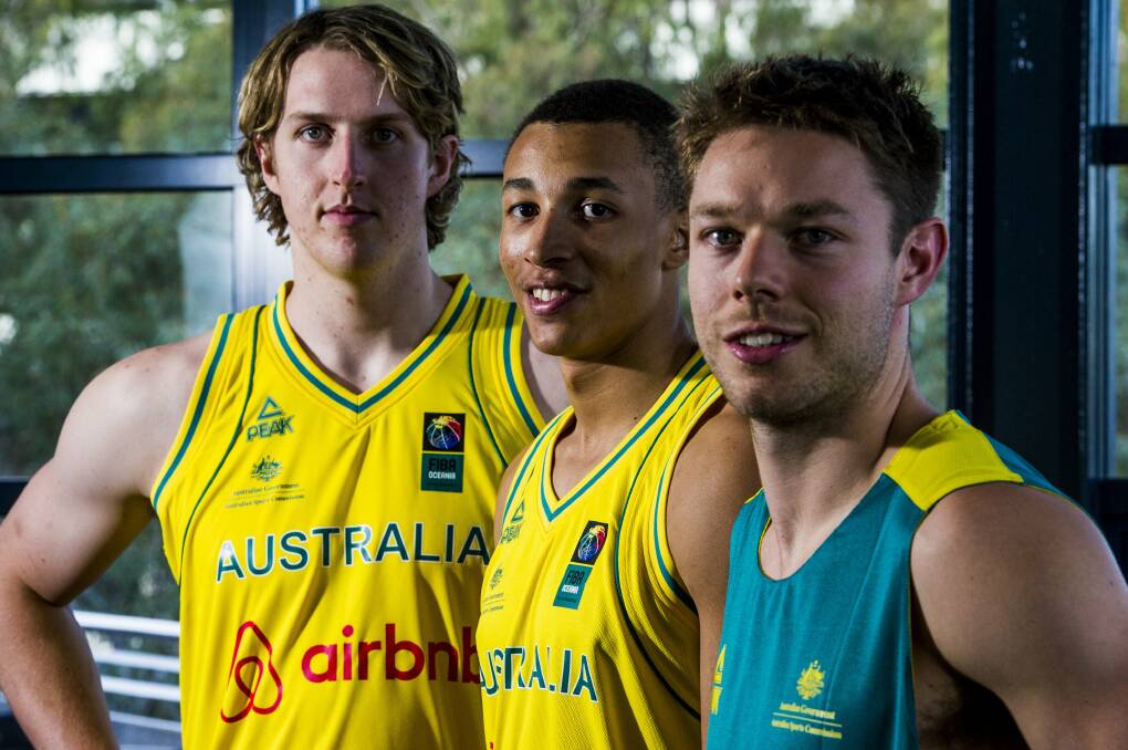 Matthew Dellavedova, right, with Boomers' team-mates Dante Exum, middle, and Cameron Bairstow, left. Picture: CANBERRA TIMES
