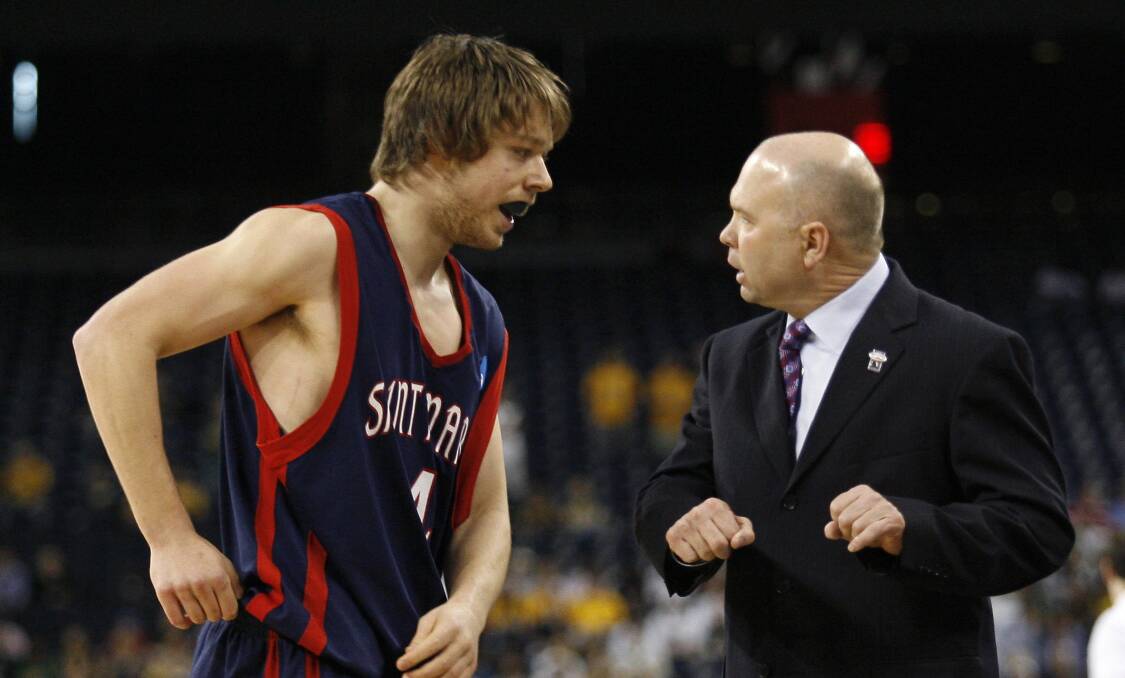 Delly with St Mary's coach Randy Bennett in 2010. Picture: REUTERS