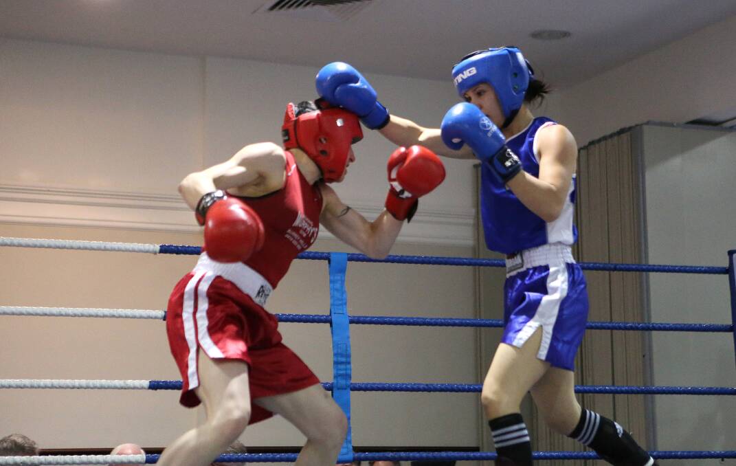 CONTEST: Carley Salmon, left, takes on Adriana Smith in the Silver Gloves titles.