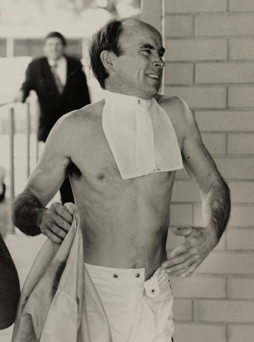 Jockey Ron Burgess in pain after a nasty fall.