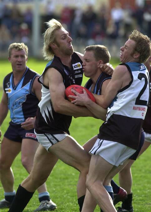 CLUB CHAMP: Jamie Bond, left, in action for the Pies.