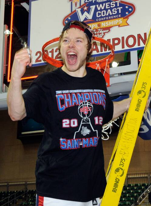 Delly cuts down the net after the Gaels' 78-74 overtime win over Gonzaga to claim the WCC championship in 2012. Picture: GETTY
