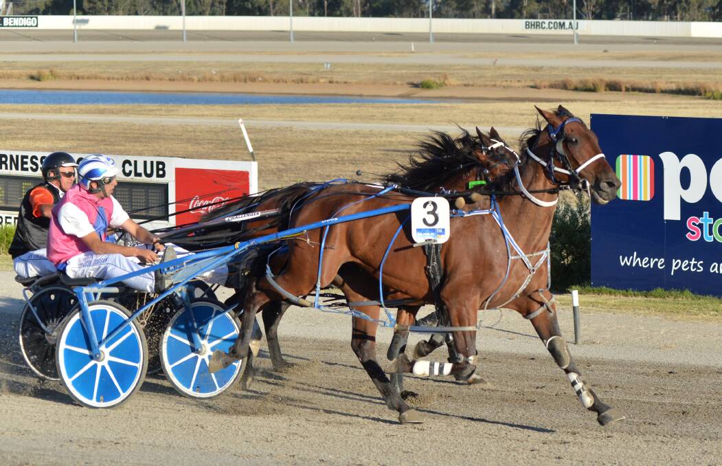 GREAT DRIVE: Johnny Tee bursts through the pack to win race three.