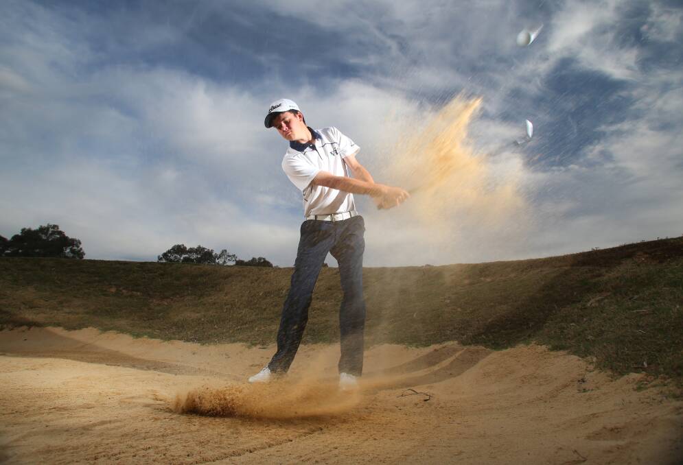 SAND SAVE: Victorian representative Kurtis Lynch blasts his way out of a bunker at Neangar Park Golf Club. Picture: GLENN DANIELS