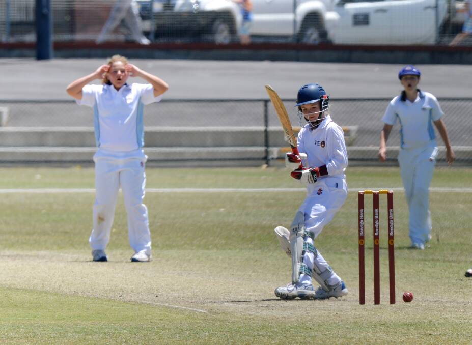 CLOSE CALL: NSW bowler Hannah Darlington and Queensland's Sam Morgan watch on as the ball just misses the stumps. Picture: BRENDAN McCARTHY