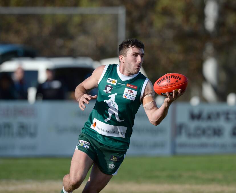 HERO: Cam Rinaldi kicked the winning point for the Roos. Picture: JIM ALDERSEY