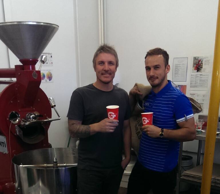 Brewhouse Coffee's Corey Scoble with FC Bendigo signing Matthew Breeze.