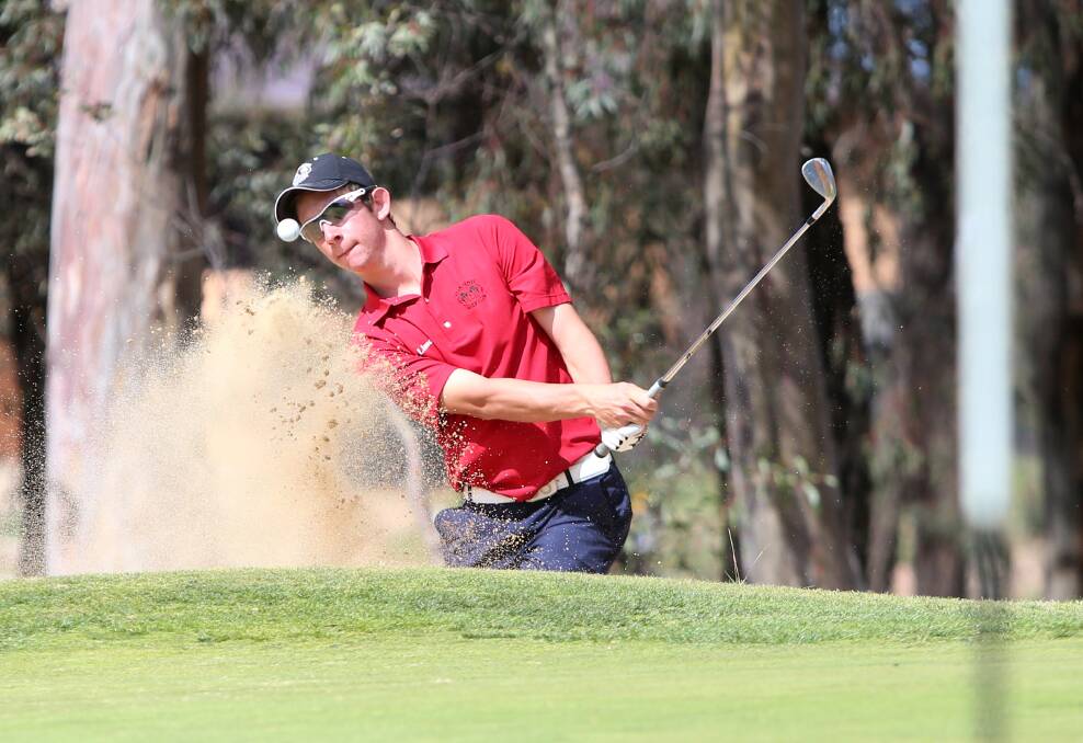 Lucas Herbert blasts his way out of a bunker on his home course at Neangar Park.
