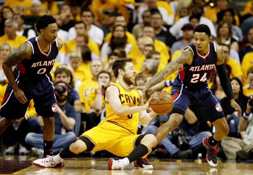 WORK ETHIC: Matthew Dellavedova fights for the ball in the game three win over Atlanta. Picture: GETTY IMAGES