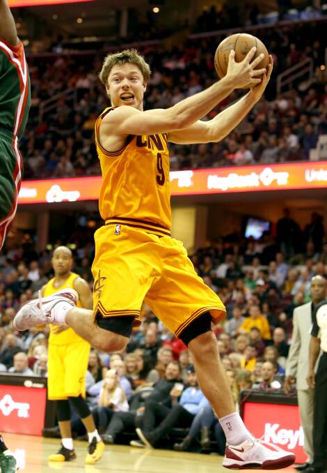 PLAYING HARD: Matthew Dellavedova grabs possession of the ball against the Milwaukee Bucks. Picture: GETTY IMAGES
