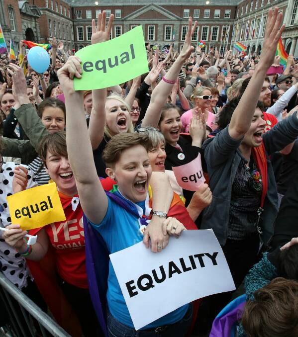 Supporters react outside Dublin Castle following the announcement of the result of the same-sex marriage referendum in Dublin on May 23, 2015. Ireland on Saturday became the first country in the world to approve gay marriage by popular vote as crowds cheered in Dublin in a spectacular setback for the once all-powerful Catholic Church. GENERIC PHOTO