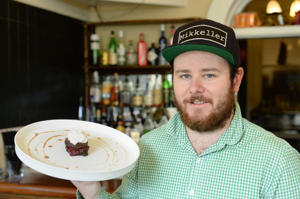 Justin McPhail from the Goldmines Hotel with his creation "Lambington". Picture: JIM ALDERSEY