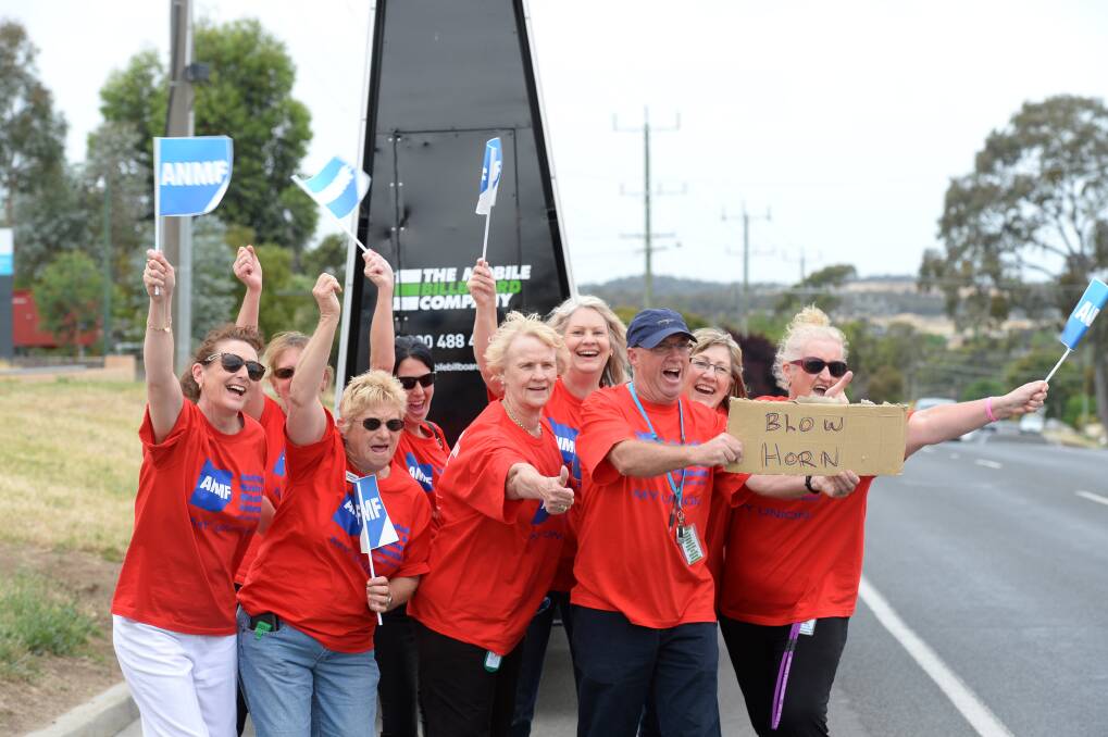 WAVE: Nurses and Carers stop work outside the Bethlehem Aged care facility on Specimen Hill Road. Picture: JIM ALDERSEY