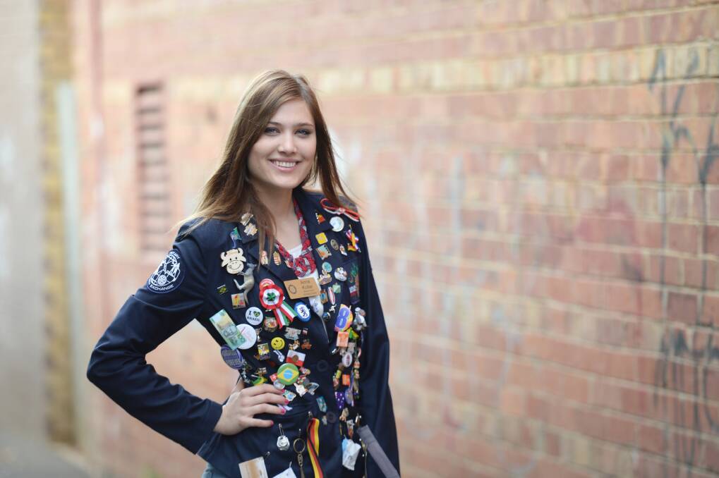 BADGE: Anna Kollar wearing her Rotary blazer covered in badges from all over Australia. Picture: JIM ALDERSEY