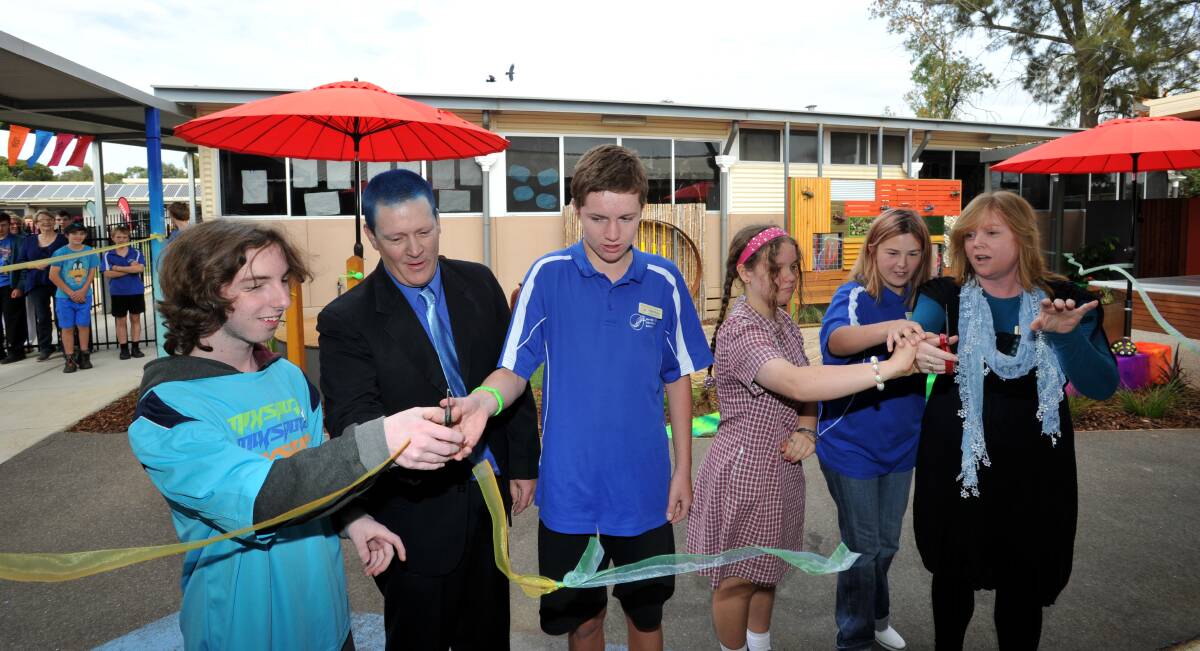 TACTILE: Students Heath and Allan along with school council president Brett Scholes and students Billie and Jacqui with principal Julie Hommelhoff cut the ribbon.  Pictures: JODIE DONNELLAN
