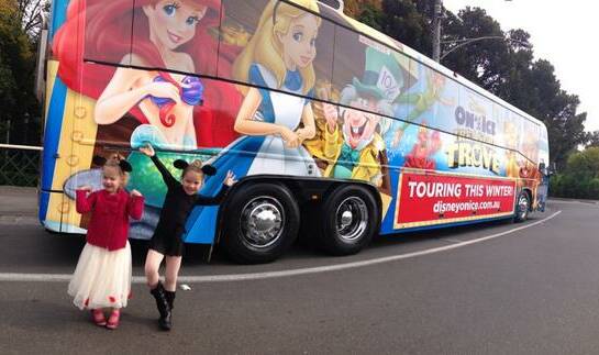 Tim Gentle snapped a picture of his two girls ZoZo, 3,  and Sammie, 4, standing in front of the Disney On Ice bus parked on Farmers Lane, Bendigo. Picture: CONTRIBUTED 