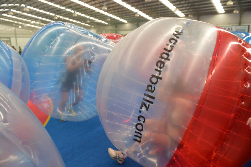 Bubble football draws a crowd on Tuesday morning.