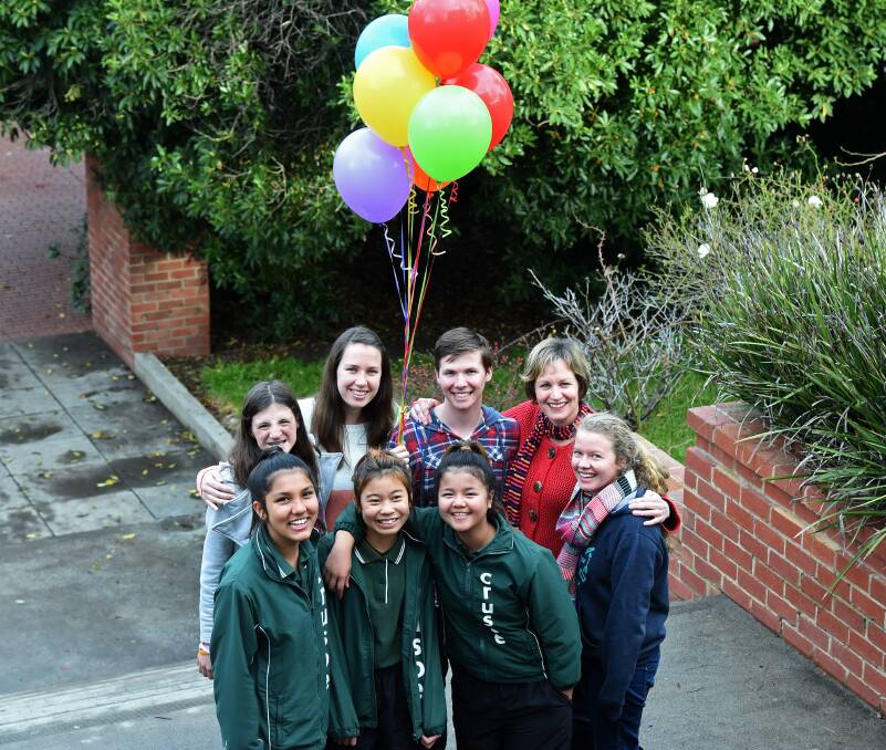 INSPIRED: Susan Pickles with some of the students who organised the fundraiser. 