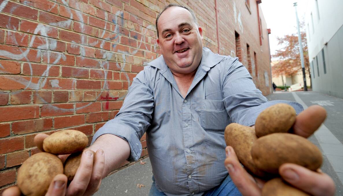 LOVE: Ian Cahill is passionate about his job of selling potatoes. Picture: JODIE DONNELLAN